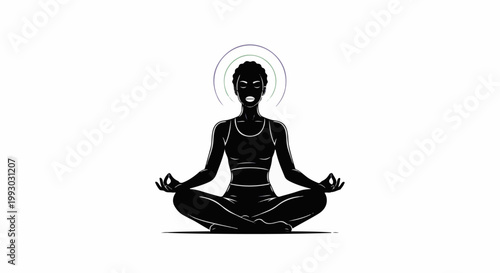 Black silhouette of person meditating in lotus pose with aura