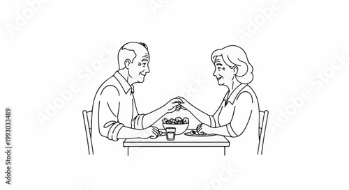 Elderly couple holding hands across table during a meal