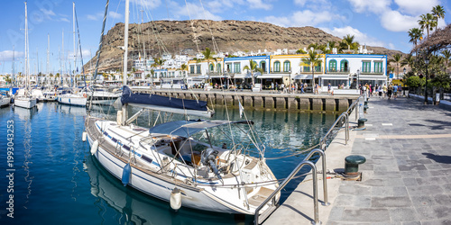 Sailing boats in Puerto de Mogan port harbor on Gran Canaria island on Canary Islands panorama holiday in Spain