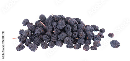 Dried aronia berries isolated on white background. Dry black chokeberry. Clipping path.