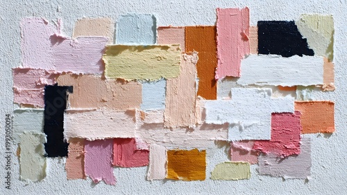 Torn masking tape pieces layered on textured paper background