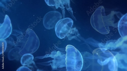 Bioluminescent blue jellyfish swimming in deep dark ocean water with glowing light effects