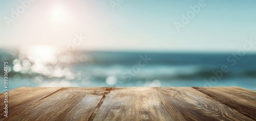 The Wooden Table Overlooking a Sunlit Ocean with Blurred Waves and Bokeh Light