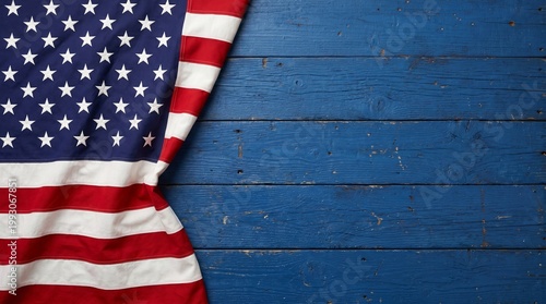 American flag draped on distressed blue wooden background with ample copy space