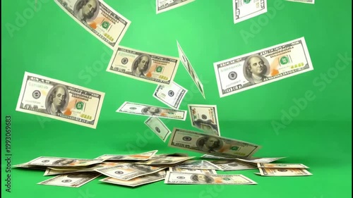 US hundred dollar banknotes floating in the air against a solid green studio backdrop
