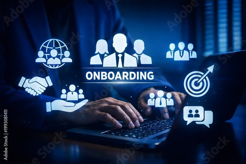 Businessman types on a laptop keyboard, surrounded by glowing holographic icons centered around the word 