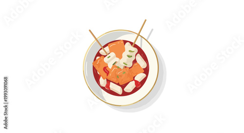 Top view of a bowl of spicy Korean tteokbokki with fish cakes.