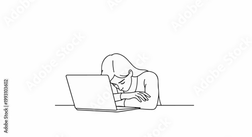 Woman slumped over a laptop, appearing exhausted and discouraged