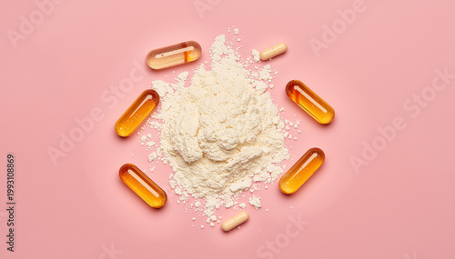 Collagen powder and various dietary supplement capsules on a pink background for health and wellness routines