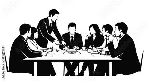 A business meeting with a presenter and attentive colleagues around a table