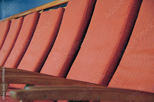 Deck chairs or sun loungers with table on balcony terrace patio promenade boat deck of classic luxury cruise ship cruiseship ocean liner with amazing oceanview