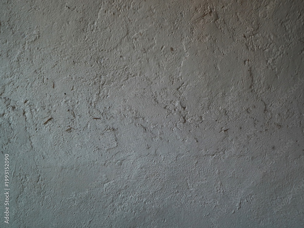 Fototapeta premium Close-up view of a textured, rough gray wall background