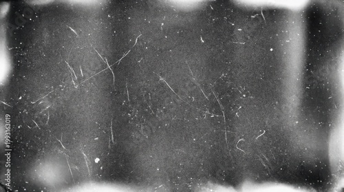 A retro film overlay with scratches, dust and subtle light leaks on a black backdrop, coarse analog grain and worn monochrome texture with vintage mood, ultra-realistic, no logos.
