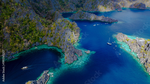 Fotografie Aerial view of a beautiful tropical island with crystal clear water with limestone cliffs as the beach, Coron, Palawan, Philippines