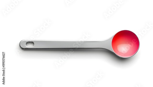 A close-up view of a silver measuring spoon with a red liquid inside on a white background