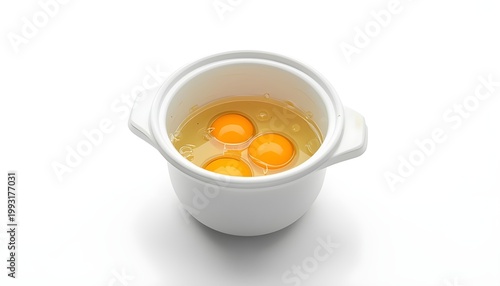 A white ceramic bowl containing three egg yolks in a clear liquid on a plain white background