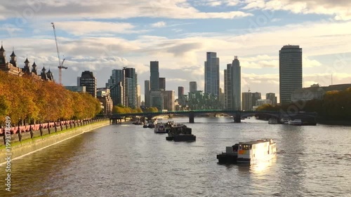 River Thames, boats and Lambeth skyscrapers at sunset. London, UK