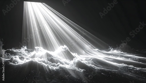 A beam of light illuminates ocean waves at night