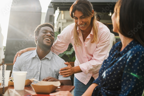Fotografie Multiracial people eating at food truck restaurant outdoor - Summer lifestyle an