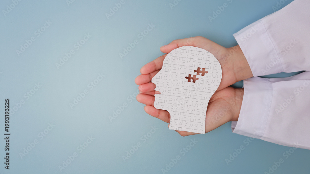 Εκτύπωση καμβά Caring doctor hand holding white paper head with puzzle piece showing visual men