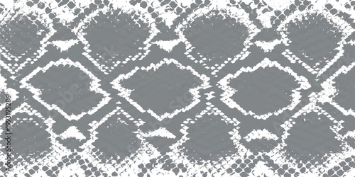 A detailed grayscale pattern resembling reptile skin or scales, with irregular diamond shapes and a textured background.