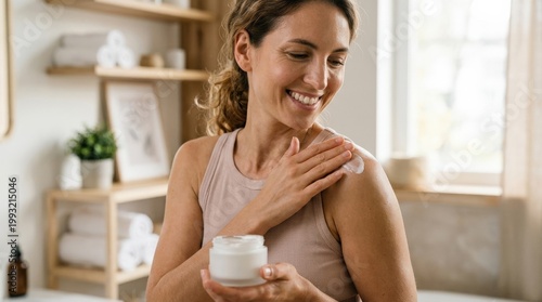 Smiling woman applying cream to shoulder, joyful self-care and body skincare concept with healthy glowing skin in a soft well-lit setting, clean beauty aesthetic, realistic detail, no logos