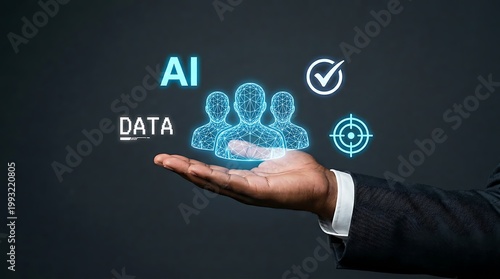 Businessmans hand displaying holographic icons representing AI data and human resources management concept
