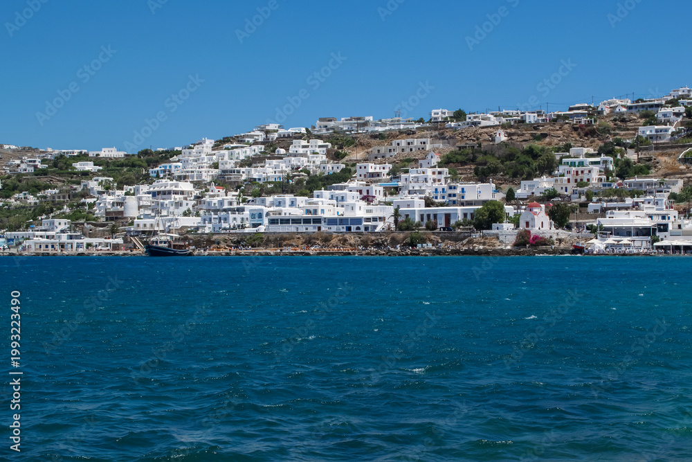 Fototapeta premium Panoramic View of White-Washed Mykonos Town Overlooking the Aegean Sea 