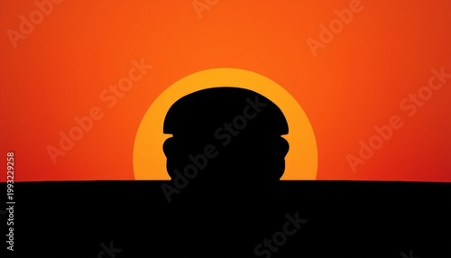 There is a silhouette of a man wearing a helmet in front of the sun