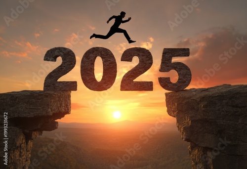 A silhouette jumps across stone 2025 over a sunset canyon. Symbolizing ambition towards the coming year.
