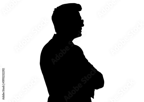 腕組みをするビジネスマンのシルエット