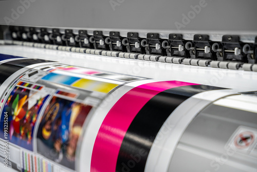 Photography Large offset printing press or magazine running a long roll off paper in production line of industrial printer machine