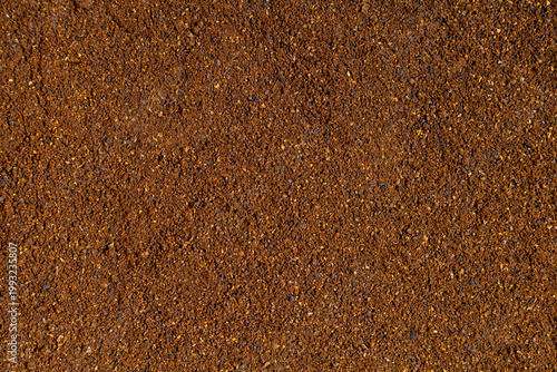 Slika na platnu Macro ground coffee powder texture organic granular surface background