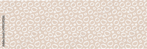 Seamless cute pattern with small irregular polka dots in neutral pastel tones. Minimal Scandinavian boho style on light background. Perfect for nursery, kids fabric, wallpaper, wrapping paper, print.