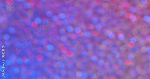 Colorful lights create a bright background with a soft glow during a party or festive event in the evening