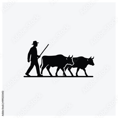 Silhouette of a herder with staff walking with three cattle