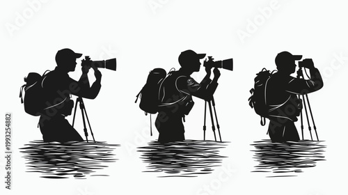 Silhouetted photographer in water with tripod and backpack capturing an image. Monochrome style