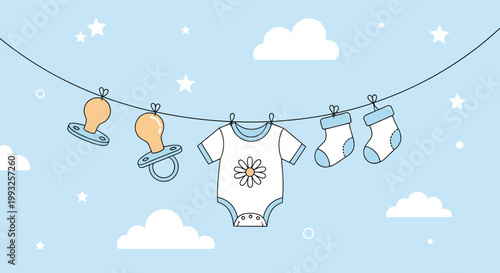 Baby boy clothing items and pacifiers hanging on a clothesline against a light blue sky with clouds and stars.