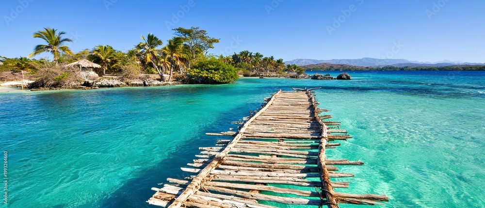 Fototapeta premium Idyllic Tropical Island with Rustic Wooden Pier and Crystal Clear Turquoise Water