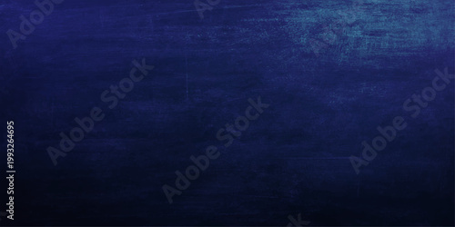 A dark blue vintage grunge background features a textured paper and rough canvas material design with a deep denim fabric pattern for a weathered textile wallpaper backdrop