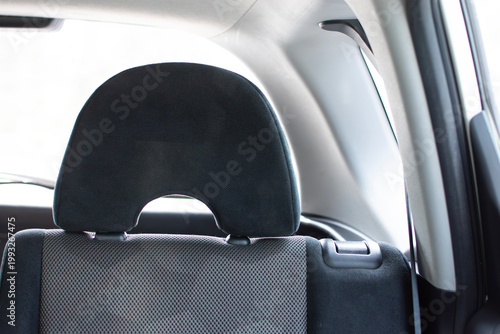 Car Back Seat Headrest, A close-up of a modern, adjustable car headrest on the back seat, focusing on automotive comfort.