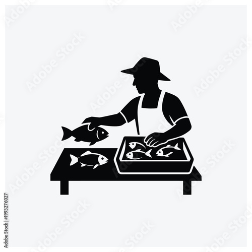 Fish vendor at a market stall selling fresh fish