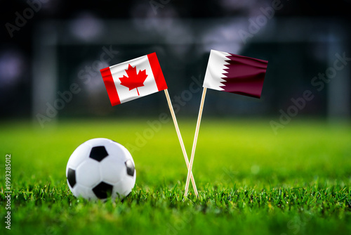 Canada vs Qatar, national flags before world championship Group B group stage match, football on green pitch with goal in the background, Vancouver, Canada, June 18, 2026