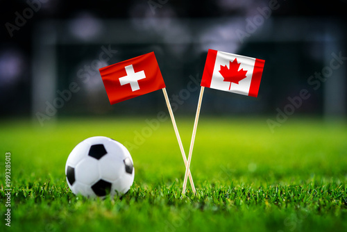 Switzerland vs Canada, national flags before world championship Group B group stage match, football on green pitch with goal in the background, Vancouver, Canada, June 24, 2026