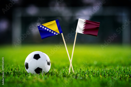Bosnia and Herzegovina vs Qatar, national flags before world championship Group B group stage match, football on green pitch with goal in the background, Seattle, USA, June 24, 2026