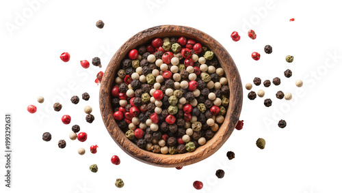 Wooden bowl filled with mixed peppercorns pink green, and black