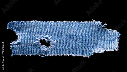 Canvastavla jeans. a frayed and torn piece of denim rag.