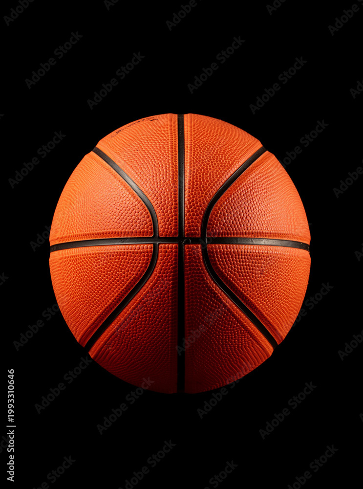 Obraz premium Orange basketball against black background. Prominent seams and textured surface visible. Clean, centered composition for graphic use. Ideal for sports, action, or team-related themes