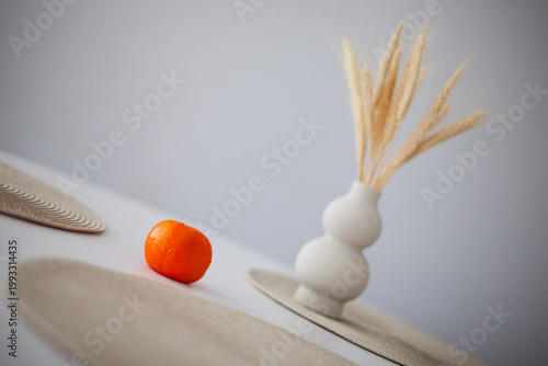 Beautiful tangerine on a stylish white table