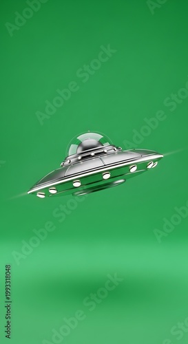 Silver UFO Hovering Against a Green Screen Backdrop.